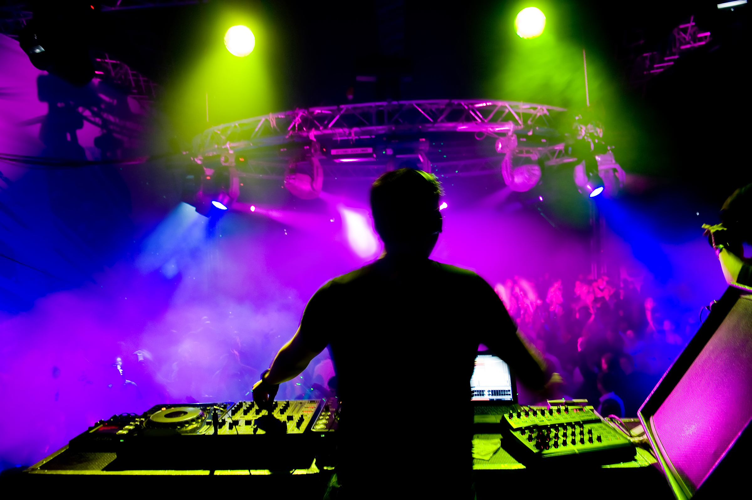 Dj at the concert, laser show and music